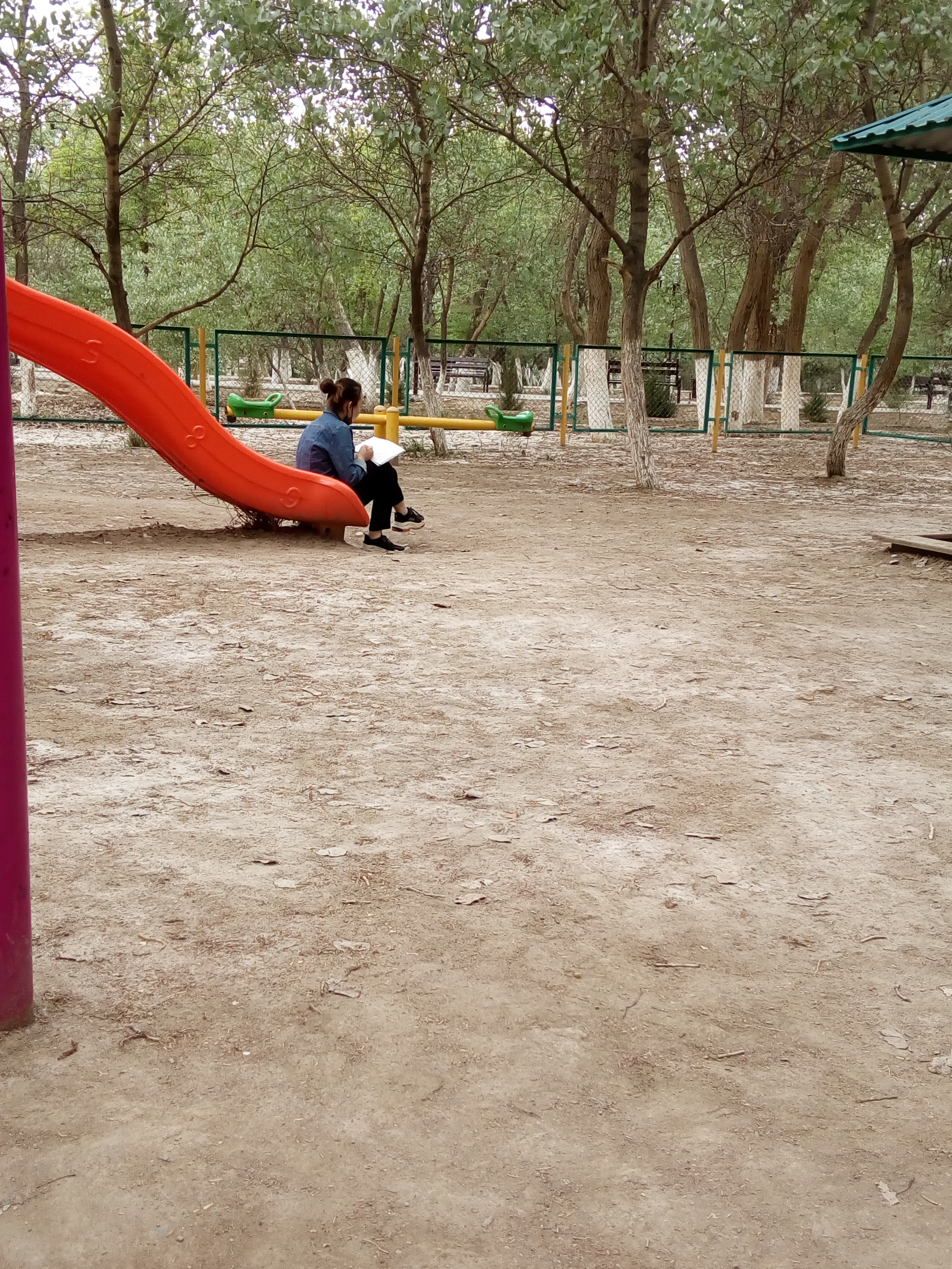 Writing Blackbird Whisper on a playground slide in May 2020.
